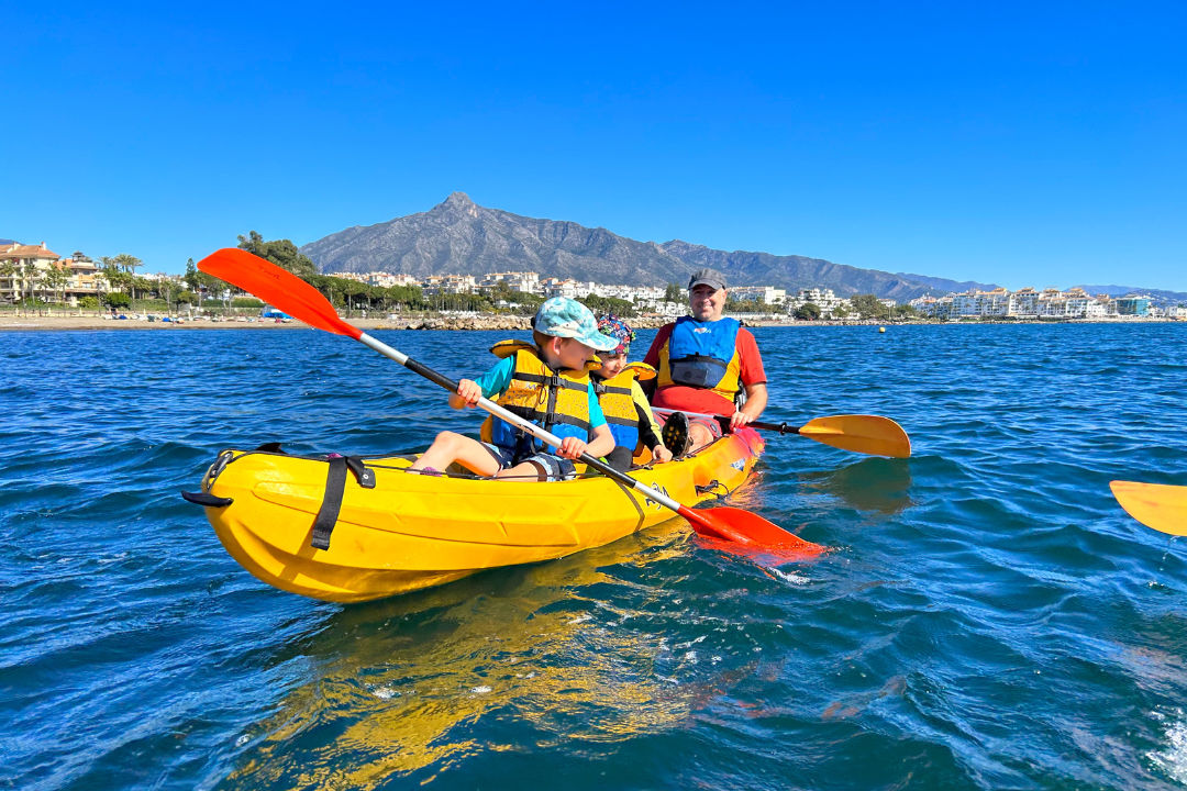 Family kayaking on Puerto Banús